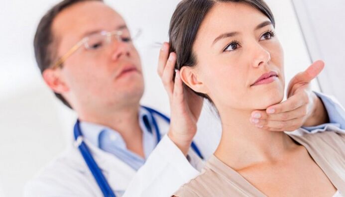 doctor examines patient with neck pain